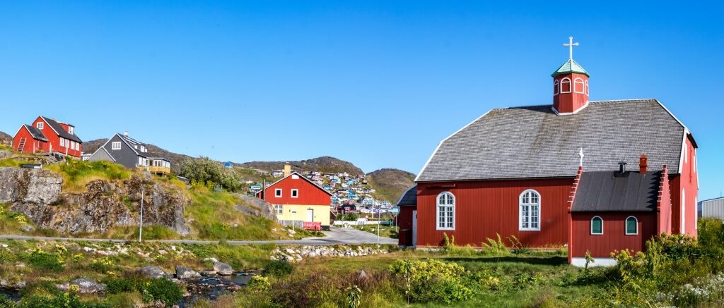 Village in Greenland with Annaasisitta Oqaluffia church