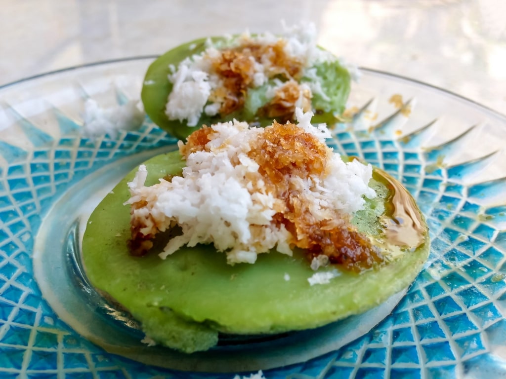 Laklak topped with coconut flakes and sugar