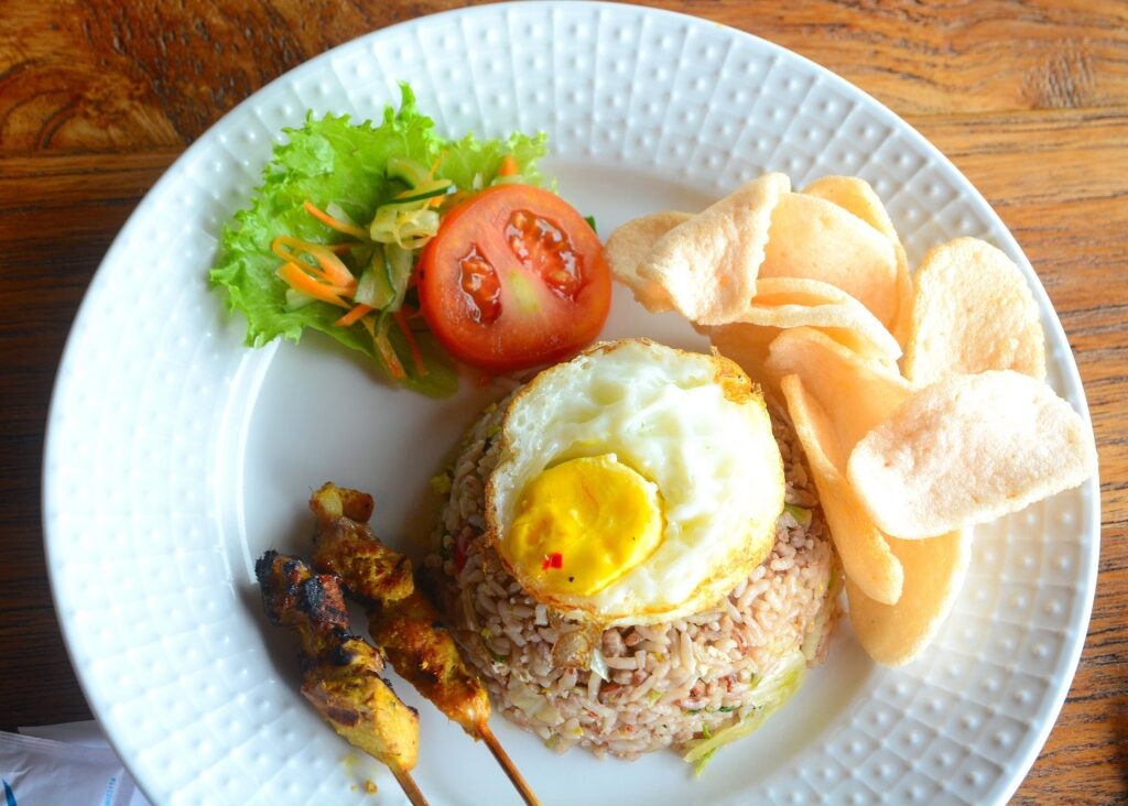 Plate of delicious nasi goreng with krupuk udang
