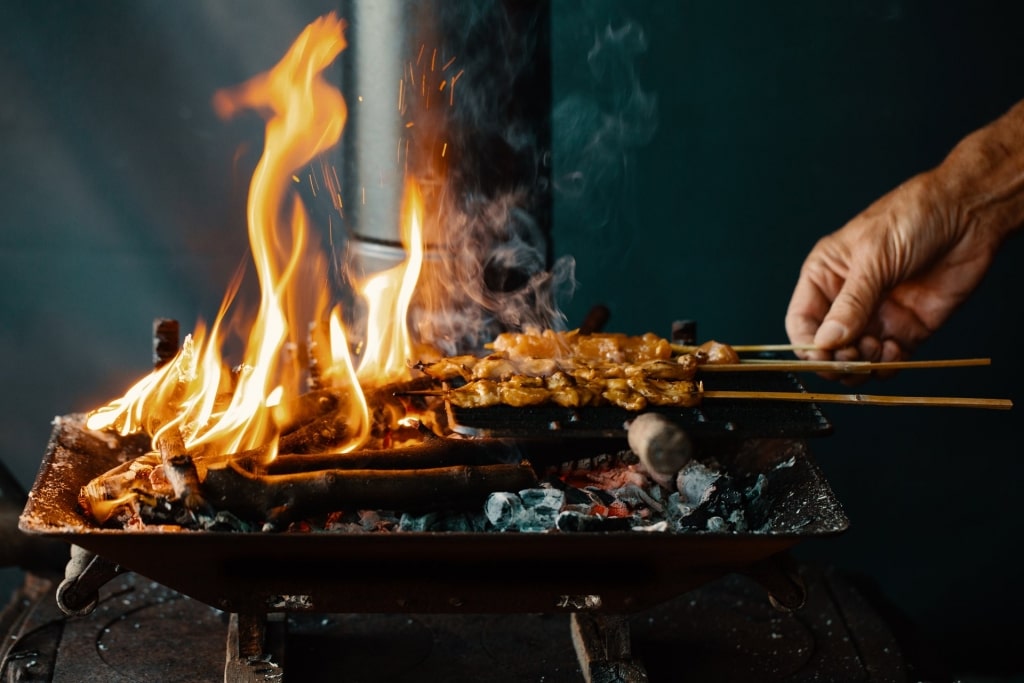 Man grilling satay 