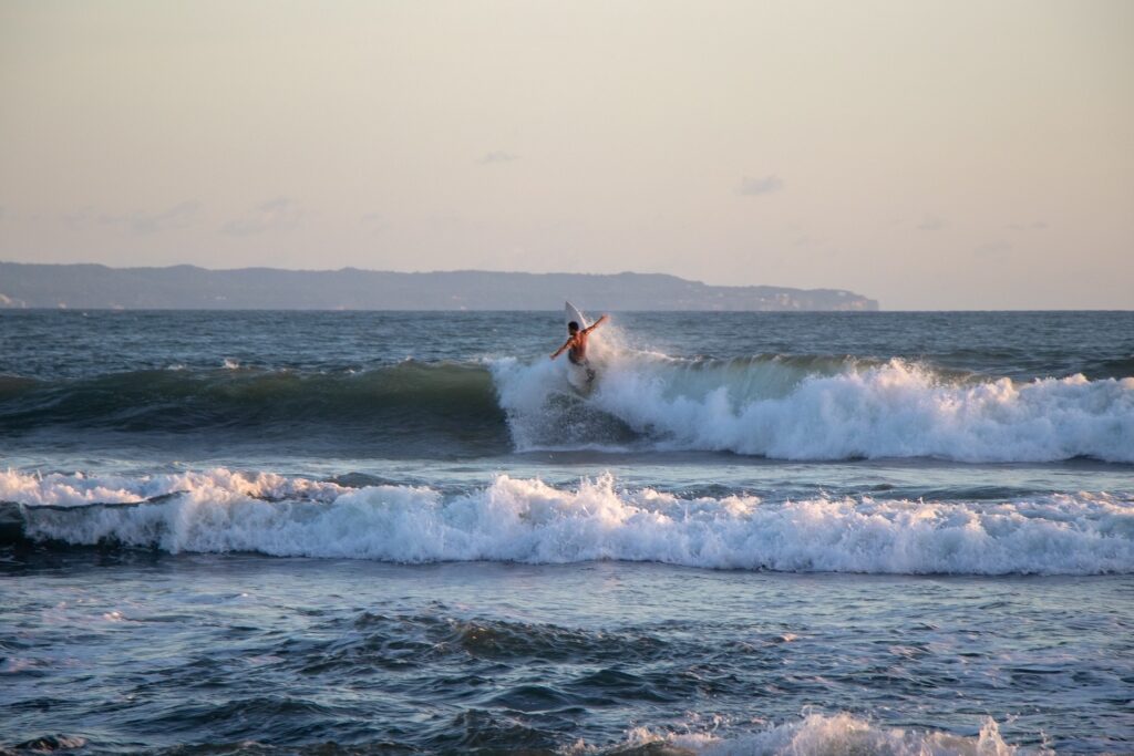Man surfing in Echo Beach, Canggu