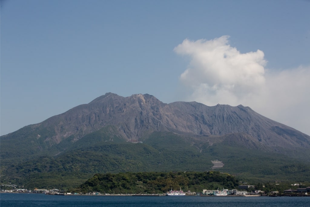 Sakurajima volcano rising dramatically over Kagoshima Bay
