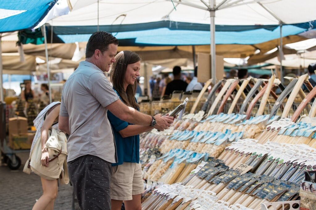 Couple shopping at one of the best markets in Italy