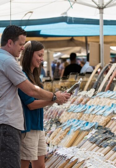 Couple shopping at one of the best markets in Italy