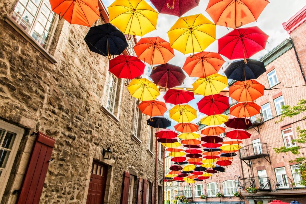 Color umbrellas lined up in Rue du Petit Champlain