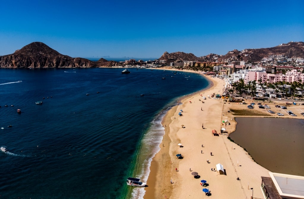 Golden beach of Medano Beach with dark blue water