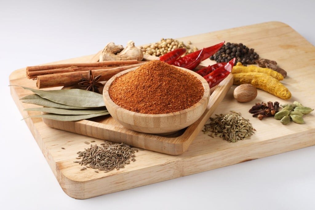 Masala blends on a wooden tray