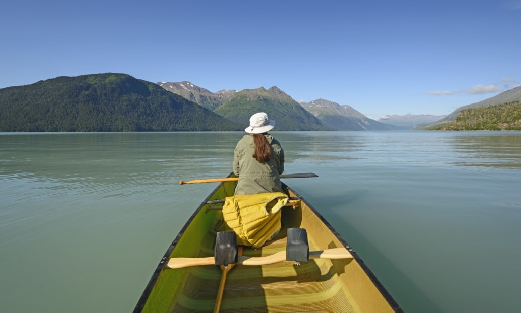 Woman kayaking in Kenai Lake, near Seward