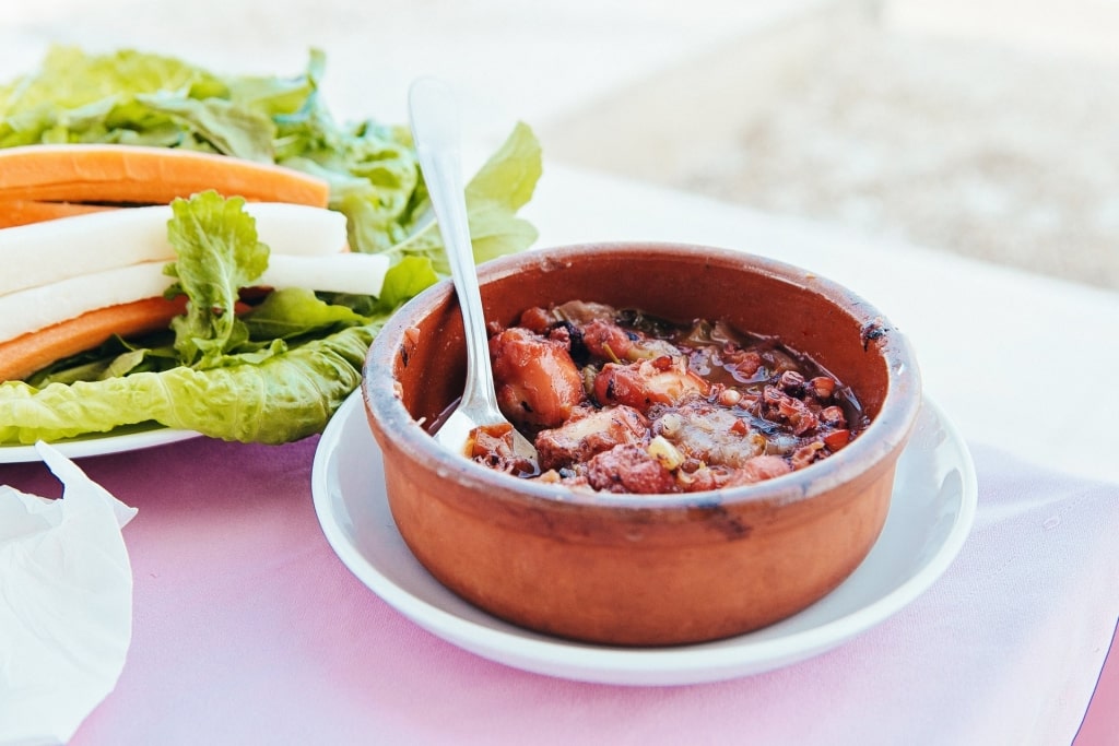 Small bowl of octopus in red wine