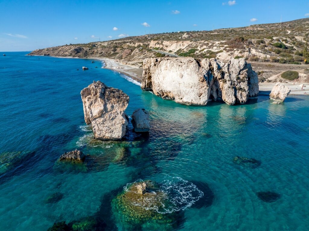 Aerial view of Aphrodite’s Rock with deep blue water