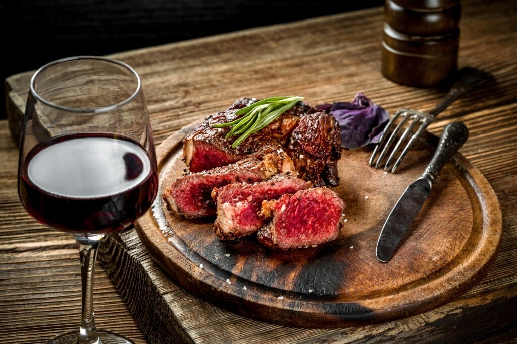 Steak with red wine on a table