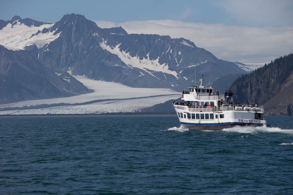 Ferry sailing along Kenai Fjords National Park during summer in Alaska