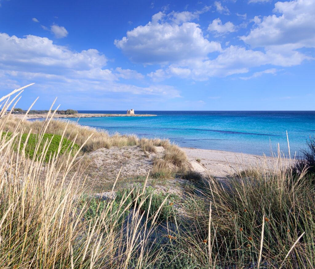 Quiet beach of Spiaggia Della Torretta with iconic watchtower