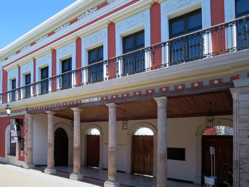 Red and white facade of Teatro Angela Peralta