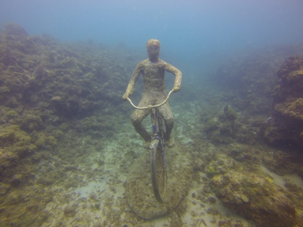 Man on a bike sculpture in Molinere Underwater Sculpture Park, Grenada