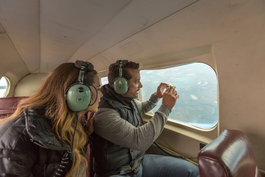 Couple on a flightseeing tour around the Arctic Circle
