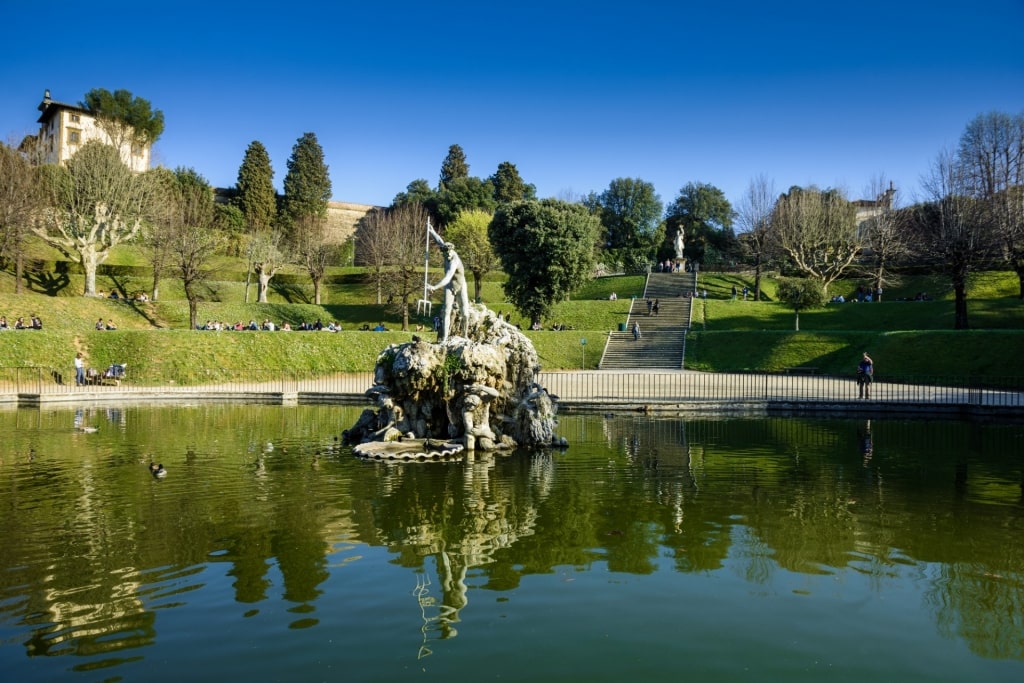 Lush landscape of Boboli Gardens with Fountain of Neptune