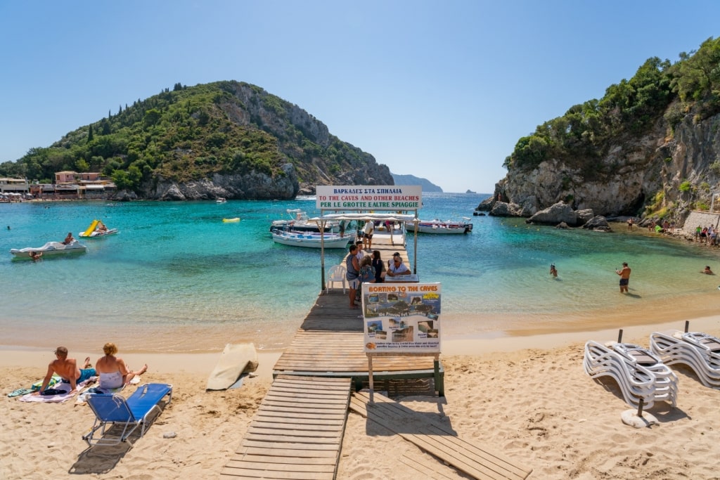 People relaxing on Paleokastritsa Bay in Corfu, Greece