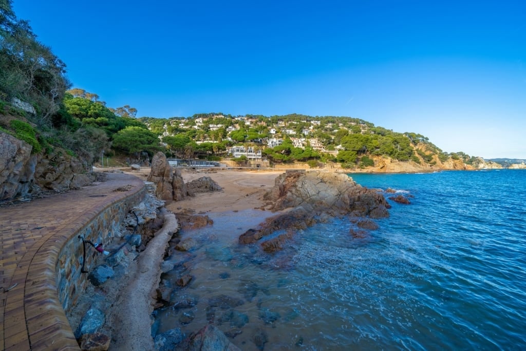 View of Cala Bona Beach with rocky shore