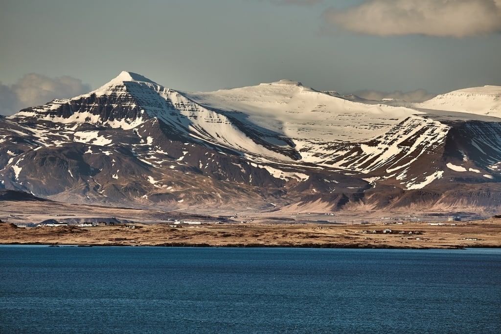 View of snowcapped Mount Esja from the water