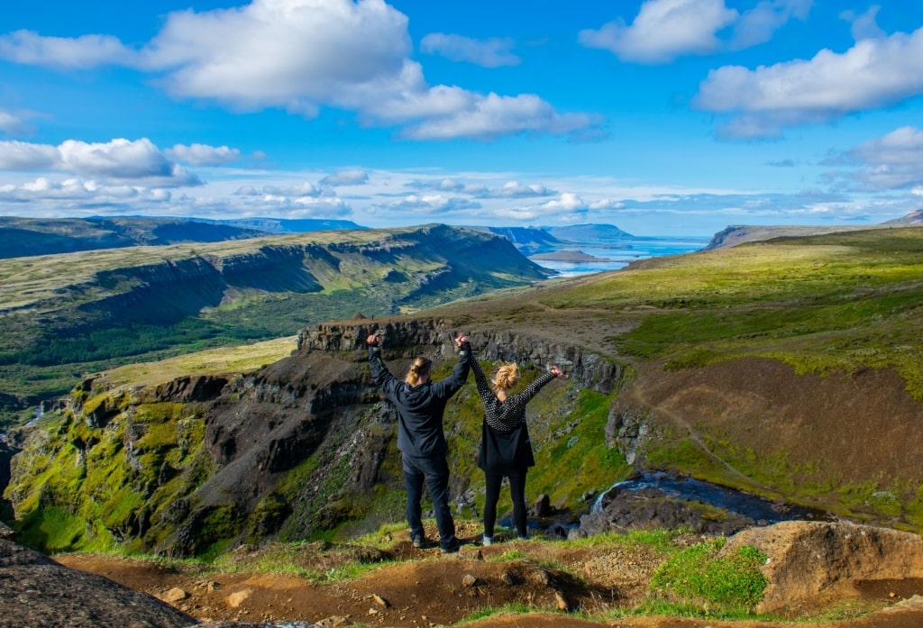 People on top of Glymur Waterfall