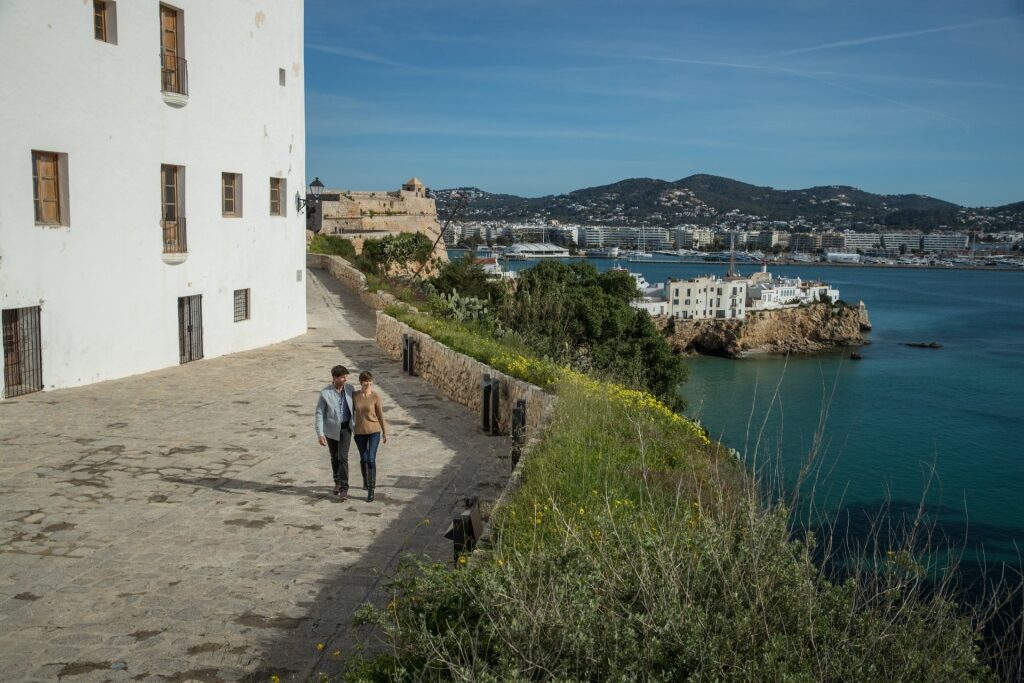 Couple strolling Dalt Vila in Ibiza, Spain