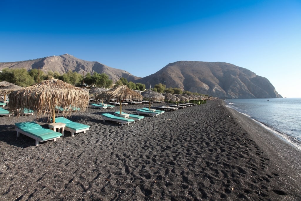 Black sands of Perissa Beach in Santorini, Greece