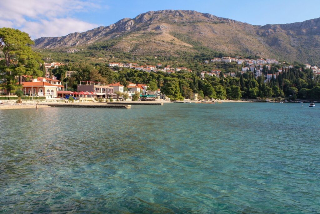 Clear waters of Cavtat Beach with mountain view