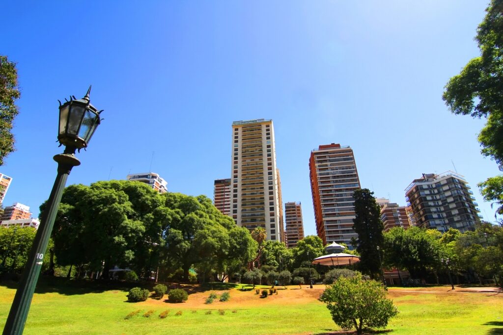 Tall buildings towering over a park in Belgrano