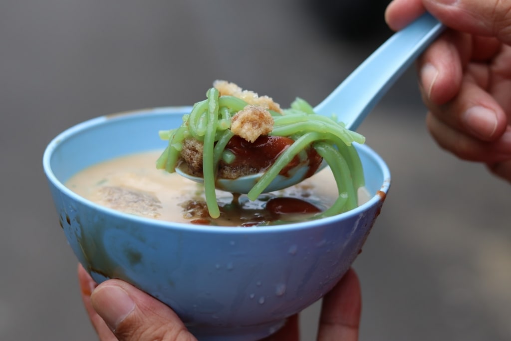 Person eating cendol