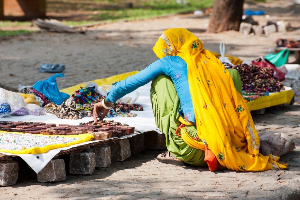 Woman selling Indian souvenirs along Fort Kochi