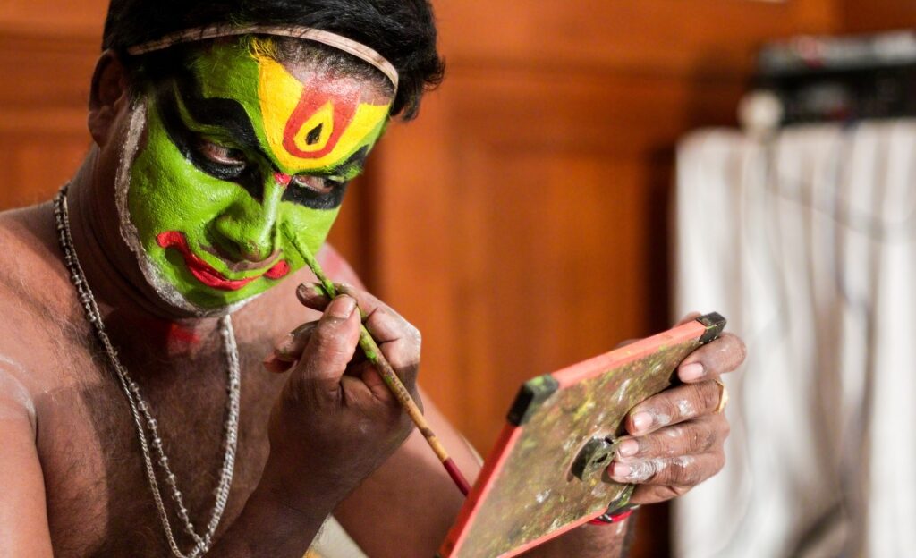 Person preparing for Kathakali dance