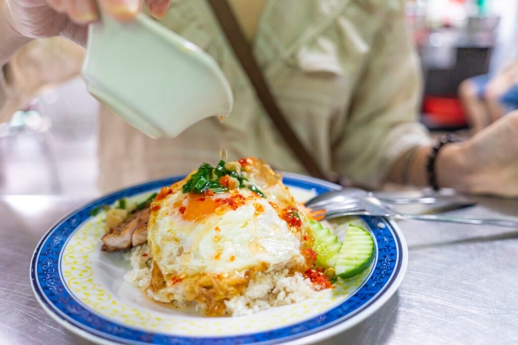 Person eating savory com tam