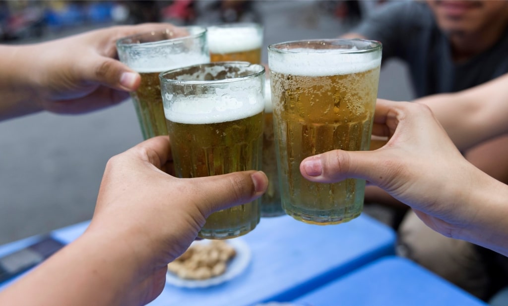 People drinking Vietnamese beer