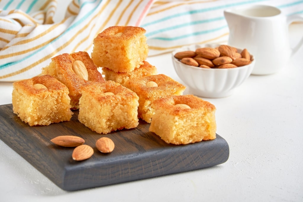 Plate of sweet basbousa with nuts