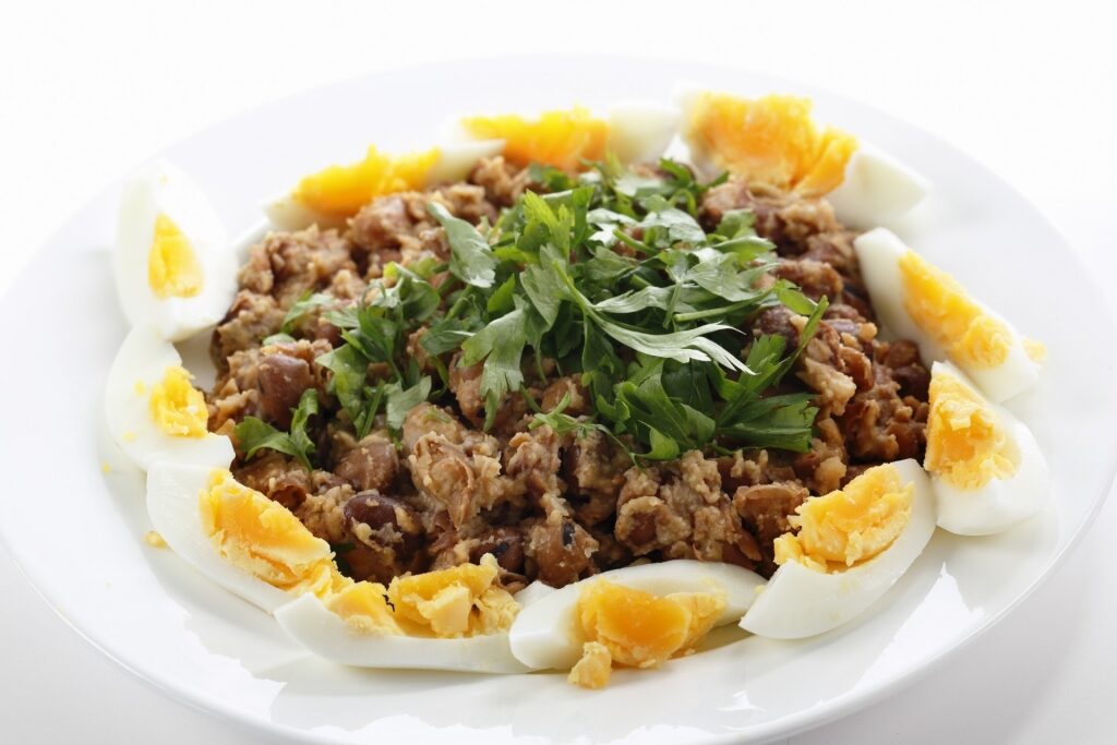 Plate of Ful medames with boiled egg