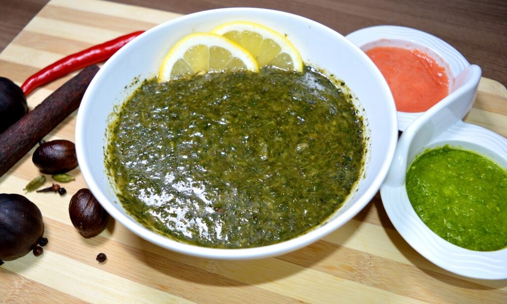 Bowl of green soup called Mulukhiya