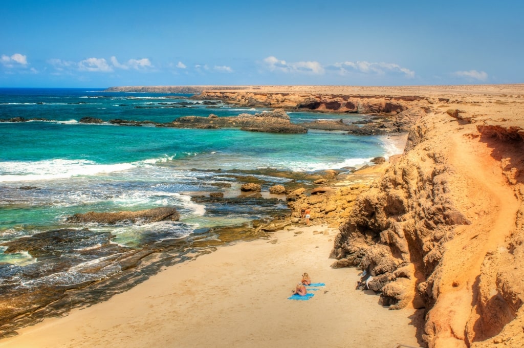 Rocky shoreline of Playa de Los Ojos