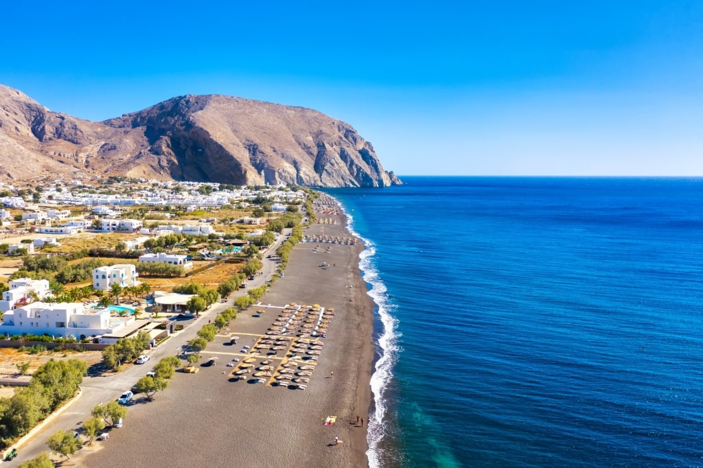 Black sands of Perissa Beach in Santorini, Greece