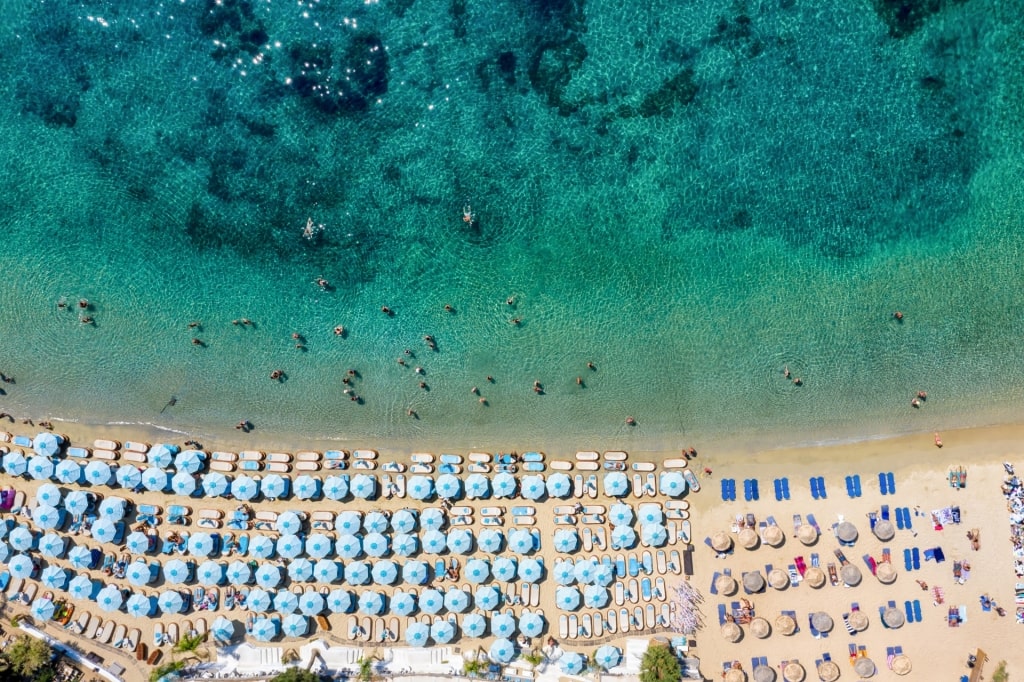 Colorful umbrellas lined up on Psarou Beach, Mykonos