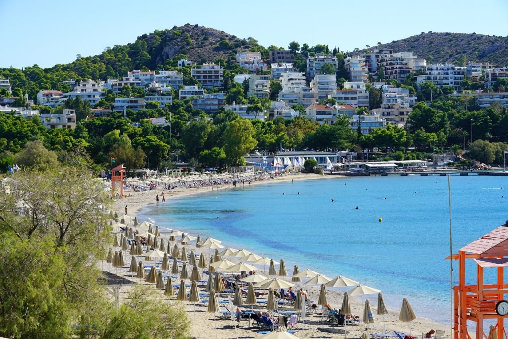 Beach umbrellas lined up on Vouliagmeni Beach, Athens