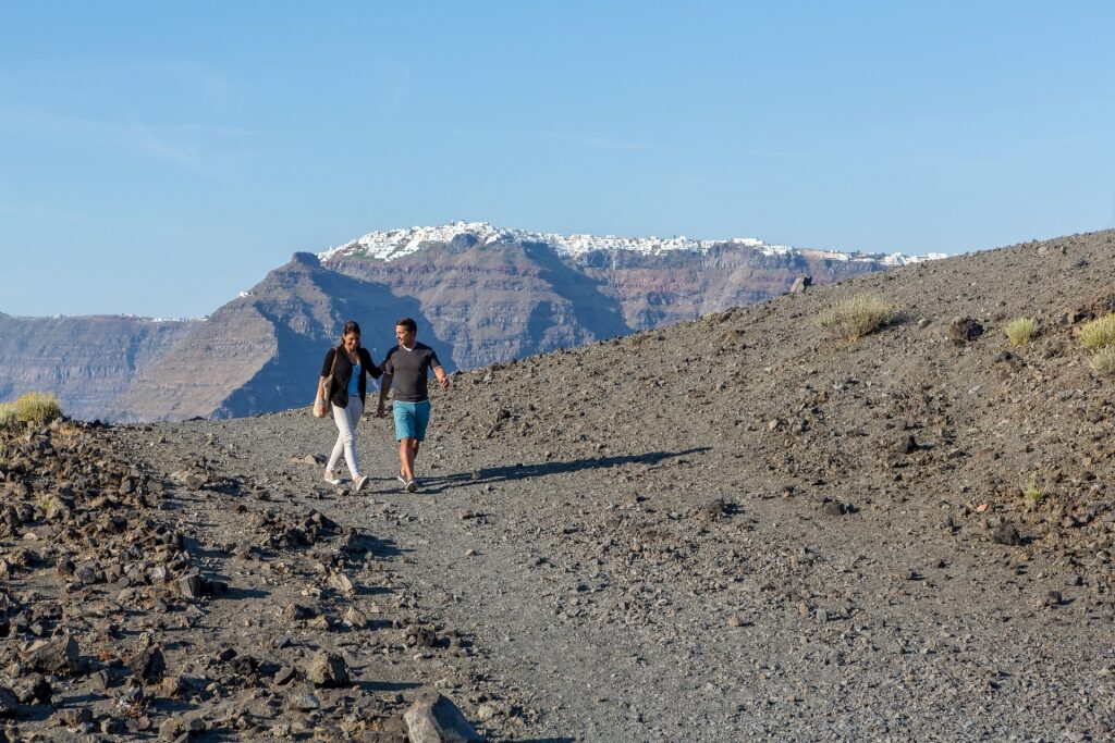 Couple hiking in Nea Kameni, Santorini