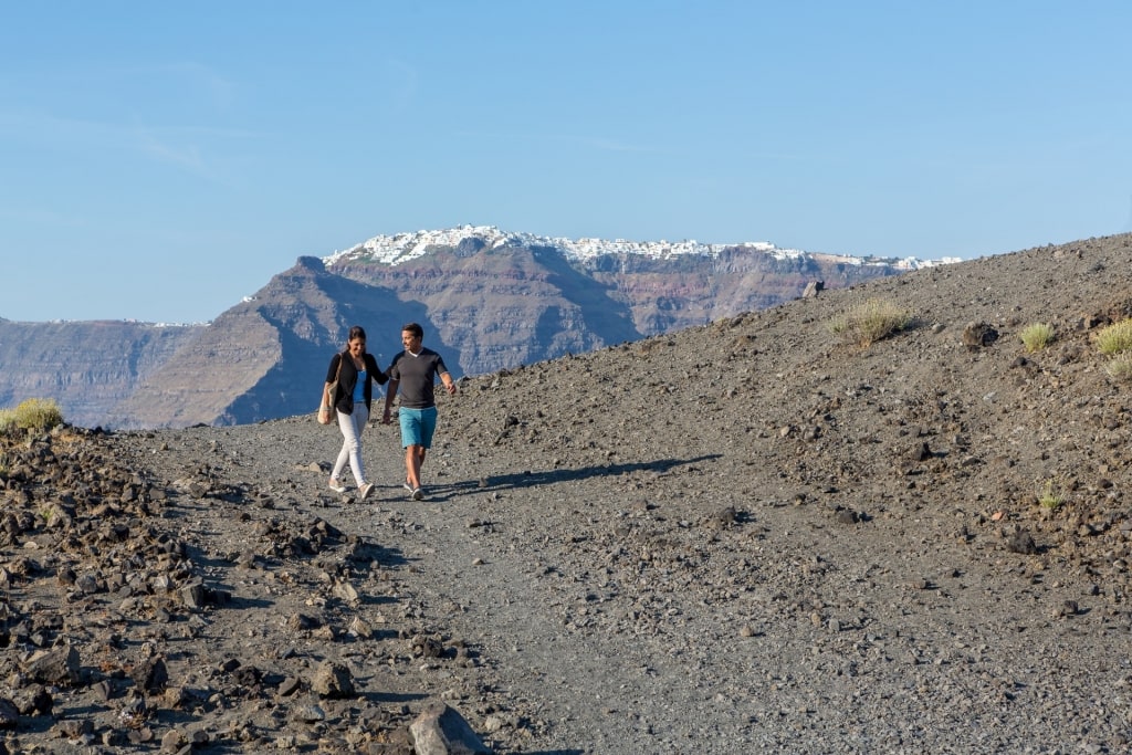 Couple hiking in Nea Kameni, Santorini