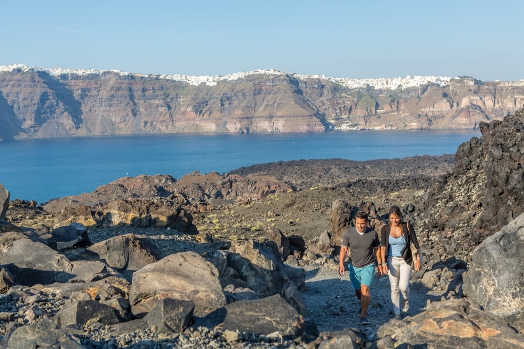 Couple hiking in Nea Kameni Island, Santorini