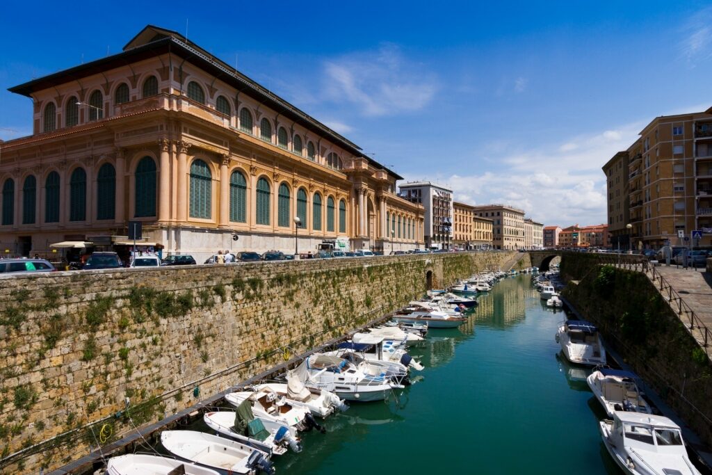 View of the canals in Livorno Italy with Mercado Centrale