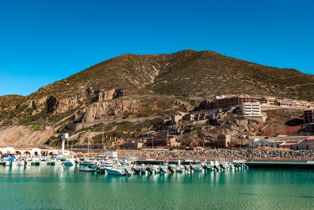 Beautiful waterfront of Buggerru with mountains