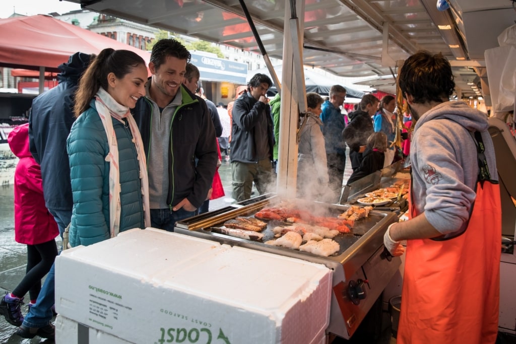 Couple strolling the Fish Market, Bergen