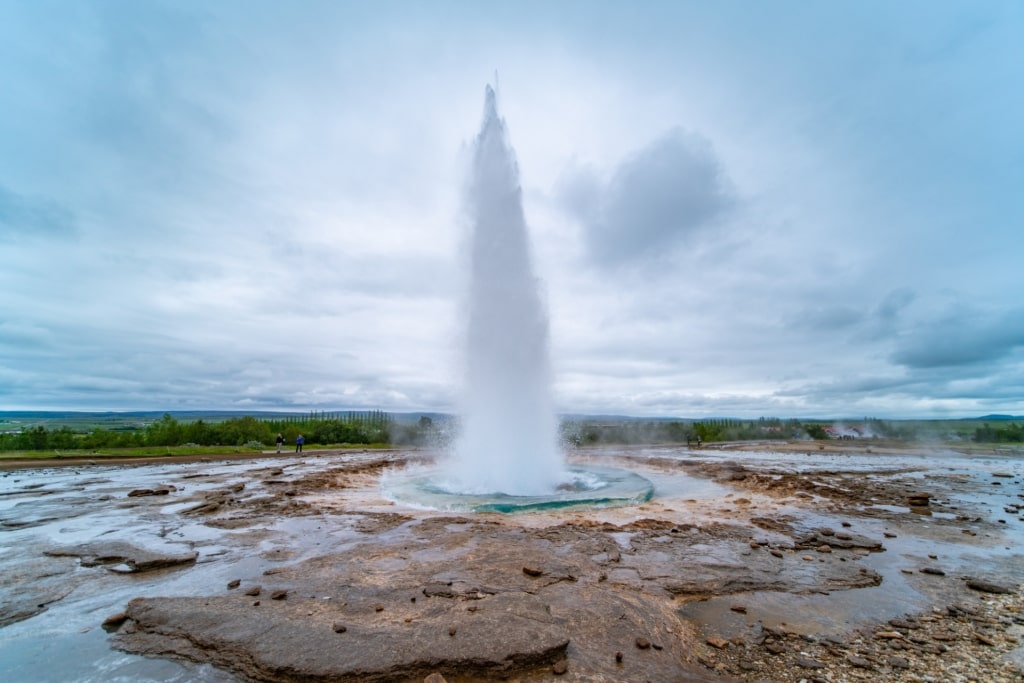 Strokkur shooting up water in Geysir Hot Springs