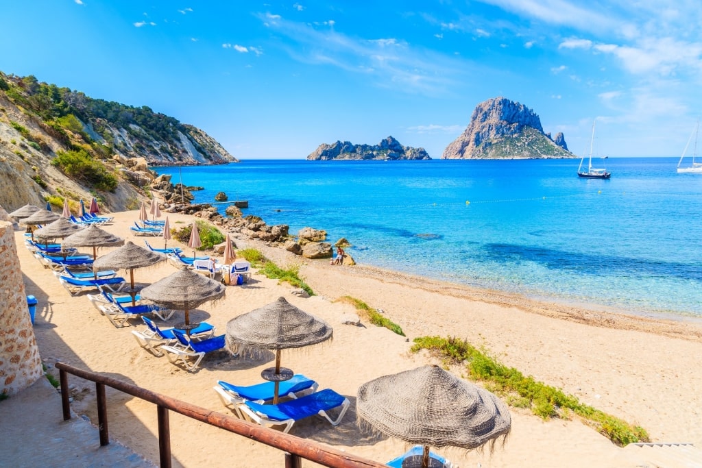 Umbrellas lined up on Cala d’Hort