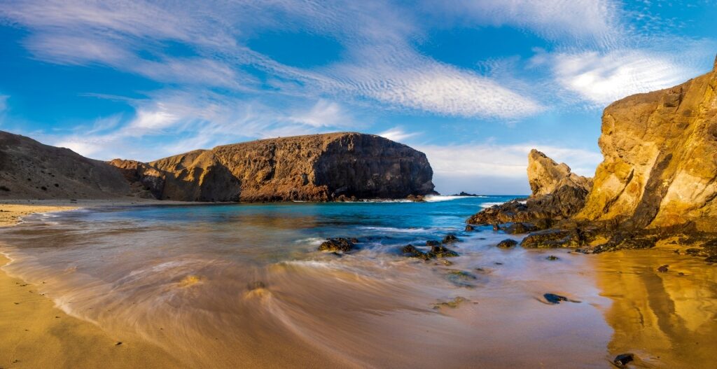 Cliffs towering over Playa de Papagayo, Lanzarote